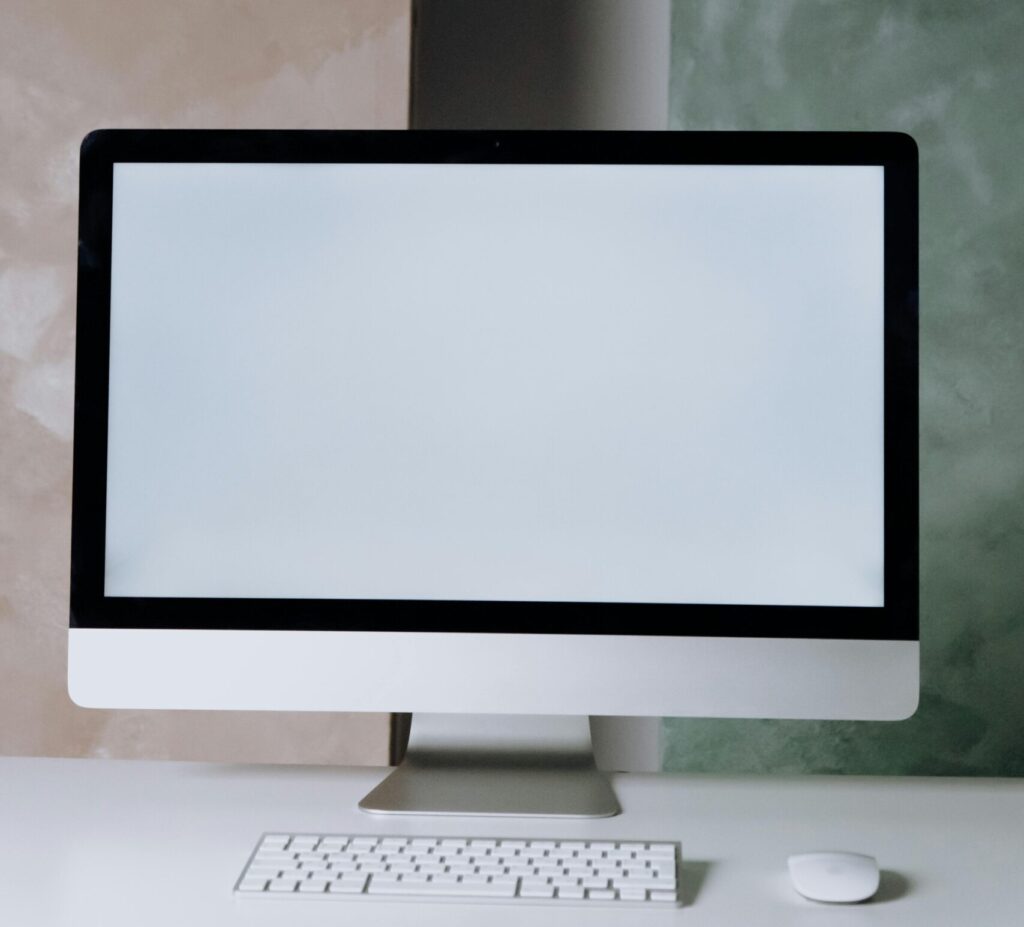 A sleek desktop computer setup in a minimalist office space with a clean design.